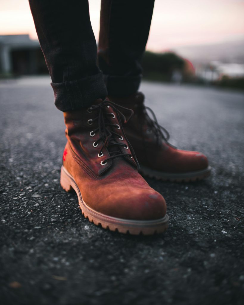a pair of brown boots with jeans