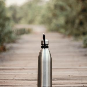 a steel waterbottle on the ground