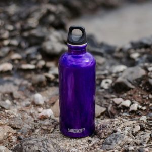 a purple waterbottle on the ground
